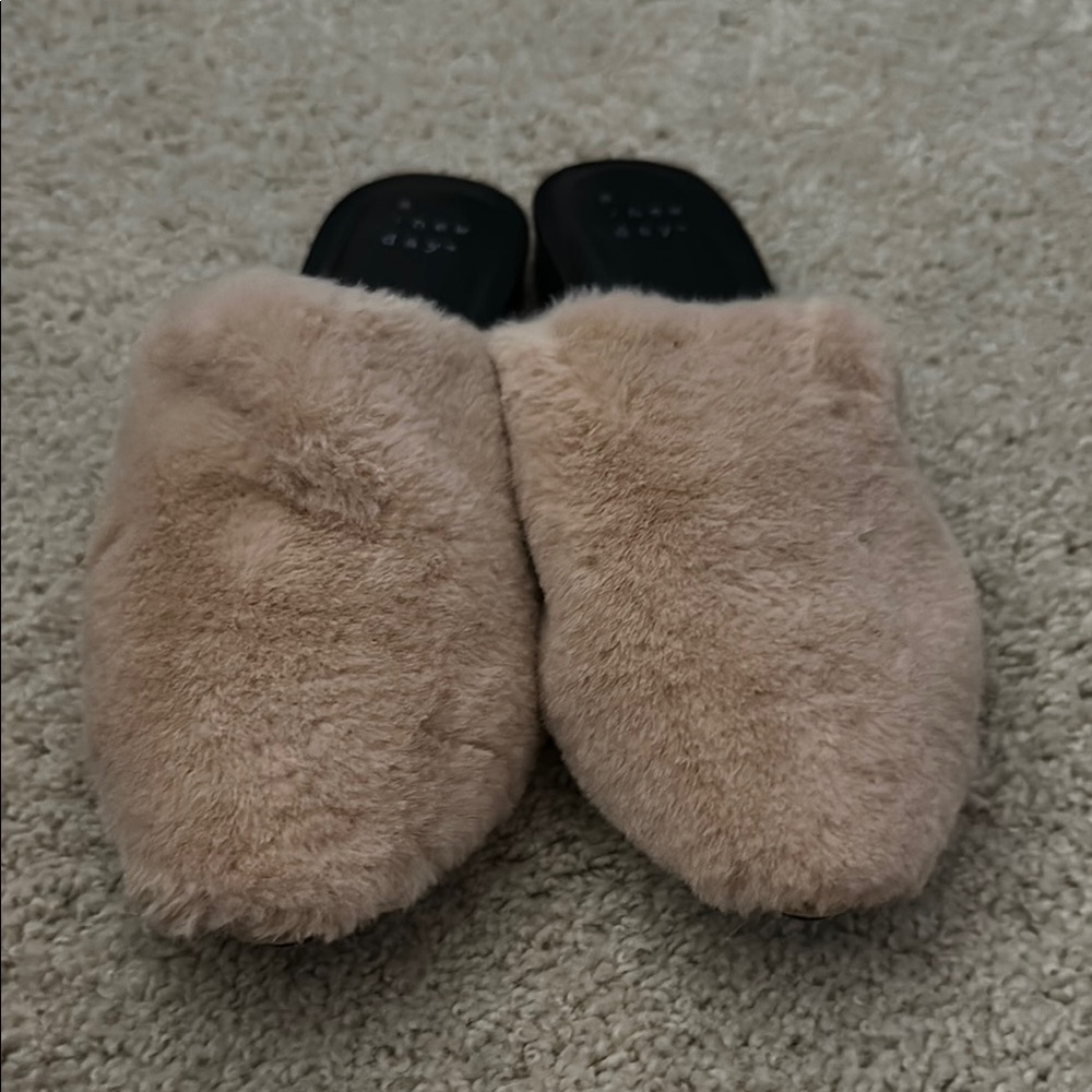 A new day fuzzy slip ons